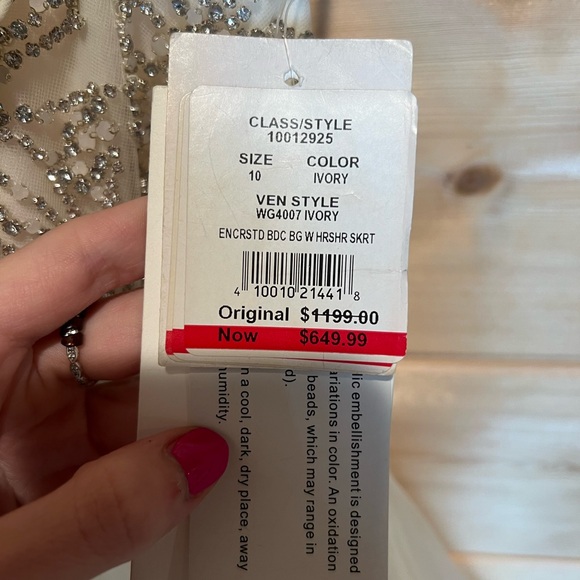 Elegant White Wedding Dress with Silver Embellishments - Picture 6 of 11